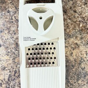 White Food Slicer with Grater. Comes with 4 blade options.